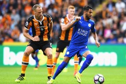 Leicester City winger Riyad Mahrez (R) competes for the ball against Hull City's David Meyler.