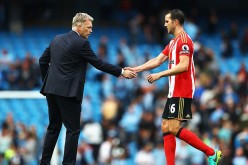 Sunderland manager David Moyes shakes hands with team captain John O'Shea after their game versus Manchester City.