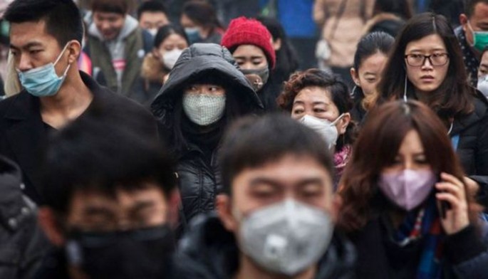 Chinese wearing cloth masks as protection against air pollution.