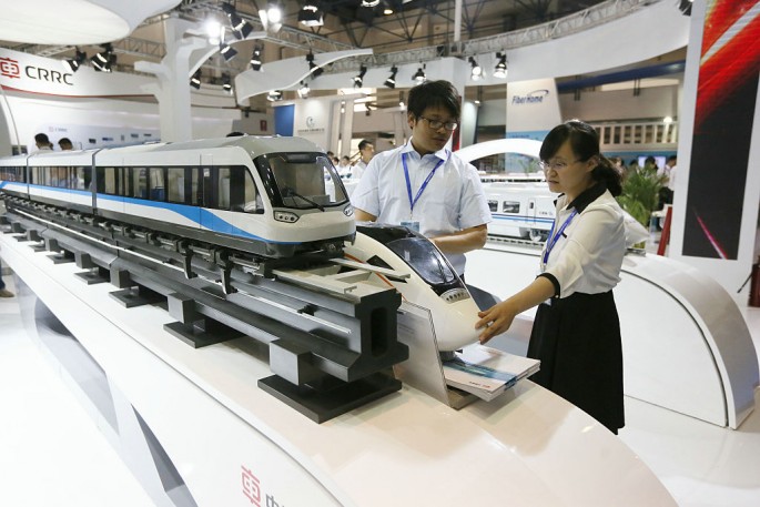 A visitor looks at a CRRC train model during the International Urban Rail Exhibition (UrTran 2015) held in Beijing in June last year.