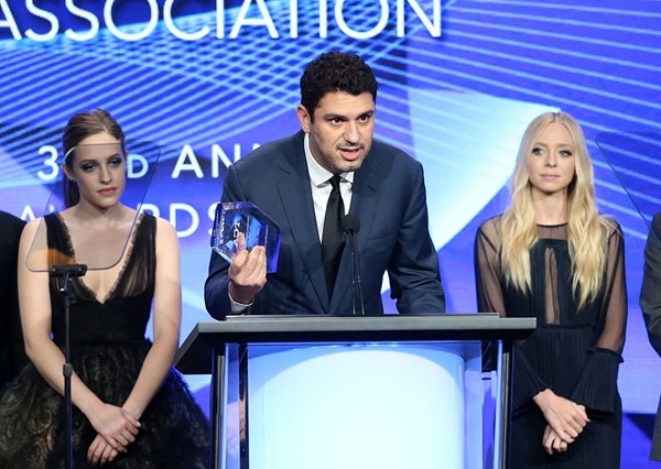 Sam Esmail accepts the award for 'Outstanding New Program' for 'Mr. Robot' with Carly Chaikin and Portia Doubleday (R) onstage at the 32nd annual Television Critics Association Awards during the 2016 Television Critics Association Summer Tour. 
