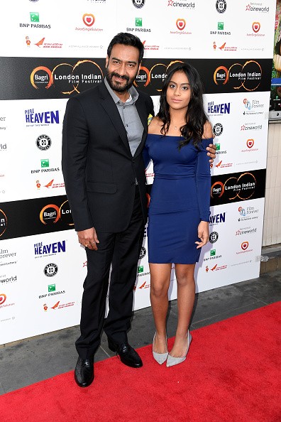 (L-R) Ajay and Nysa Devgn arrive at the opening night of the London Indian Film Festival at Cineworld Cinemas on July 14, 2016 in London, England. 