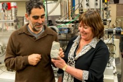 Researchers Allen Nutman and Vickie Bennett show a 3.7-billion-year-old fossilized stromatolite from Isua, Greenland. 