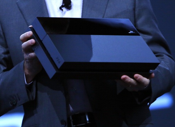 Andrew House, President and Group CEO Sony Computer Entertainment Inc., holds up a Playstation 4 at the Sony Playstation E3 2013 press conference.