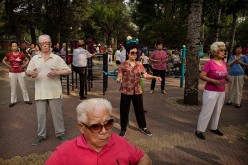No to Ageism: Per government’s new regulation, travel agencies should not deny services to senior citizens. (Above) A group of elders exercise together at Beijing’s Ritan Park on June 9, 2016.