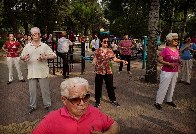 No to Ageism: Per government’s new regulation, travel agencies should not deny services to senior citizens. (Above) A group of elders exercise together at Beijing’s Ritan Park on June 9, 2016.