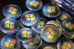  Buttons with the Microsoft logo are seen at a Comp USA store.