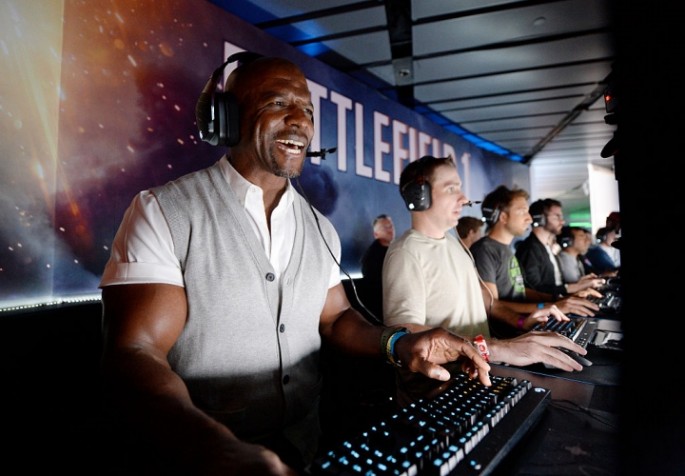 Actor Terry Crews plays the video game 'Battlefield 1' after a Electronics Arts news conference on June 12, 2016 in Los Angeles, California.