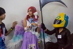 Japanese cosplay blooms in Myanmar as coplayers wait in the stairway before going on stage at MICT park on April 23, 2016 in Yangon, Burma.  