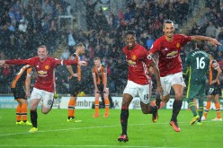 Manchester United players (from L to R) Wayne Rooney, Marcus Rashford, and Zlatan Ibrahimović celebrating their goal against Hull City.