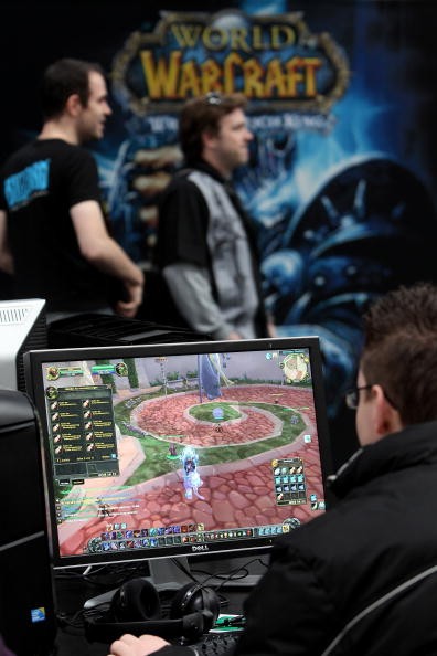 Visitors play World of WarCraft in the gaming hall at the CeBIT Technology Fair.