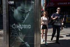 An advertisement for Apple Music is posted on the streets of Manhattan in New York City on August 7, 2015.