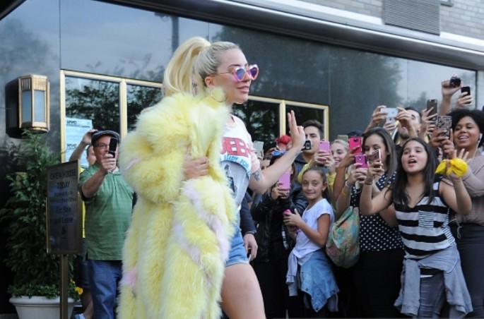 Lady Gaga wears short shorts and a large fur coat steps out in Manhattan on May 11, 2016 in New York, New York. 