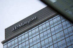 A signage of J.P. Morgan headquarters is displayed atop Chater House in the central business district of Hong Kong.