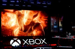 Katsuhiro Harada, and Michael Murray introduce 'Tekken7' video game during Microsoft Corp. Xbox at the Galen Center on June 13, 2016 in Los Angeles, California.