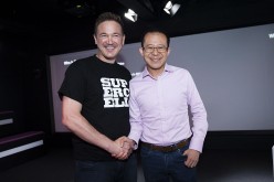 Finnish game company Supercell Co-founder and CEO Ilkka Paananen and Martin Lau, President of Tencent, shake hands after Tencent announced it had agreed to buy Supercell Oy from Softbank.