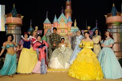 A person dressed as Princess Tiana (C) is joined on stage by all of the princesses of Disney movies during Princess Tiana�s official induction into the Disney Princess Royal Court at The New York Palace Hotel on March 14, 2010 in New York City.