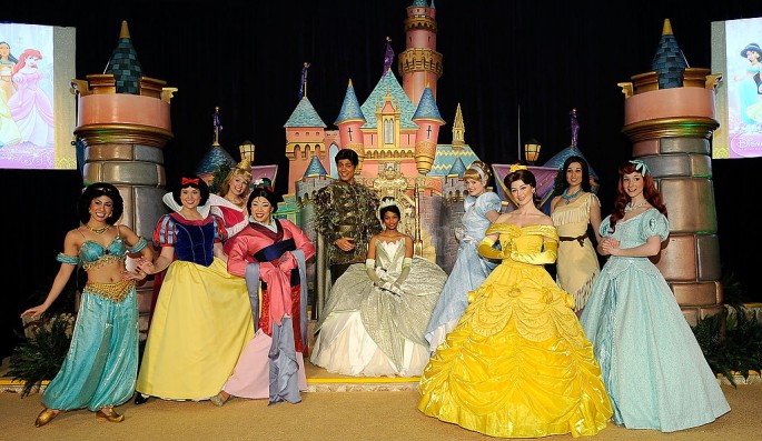 A person dressed as Princess Tiana (C) is joined on stage by all of the princesses of Disney movies during Princess Tiana�s official induction into the Disney Princess Royal Court at The New York Palace Hotel on March 14, 2010 in New York City.