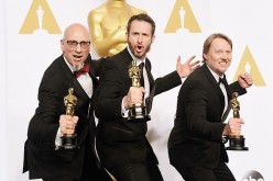 (L-R) Chris Williams, Roy Conli, and Don Hall, winners of the Best Animated Feature Award for 'Big Hero 6', pose in the press room during the 87th Annual Academy Awards at Loews Hollywood Hotel on February 22, 2015 in Hollywood, California