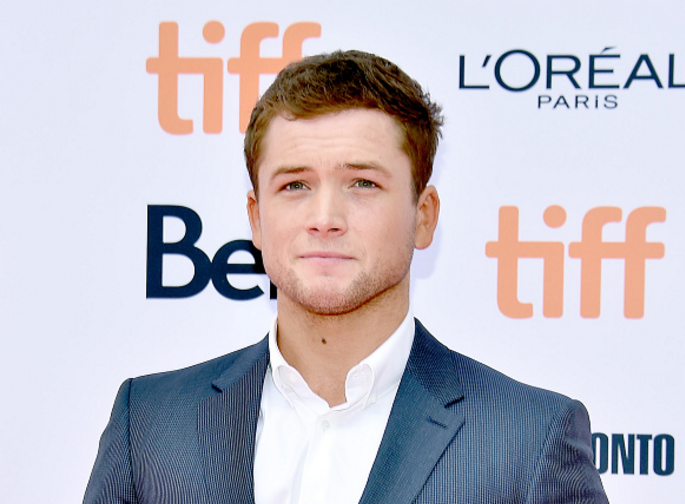 2015’s surprise box office hit “Kingsman: The Secret Service” is back for a sequel, and lead star Taron Egerton revealed the scoop on what’s to come in the upcoming film.