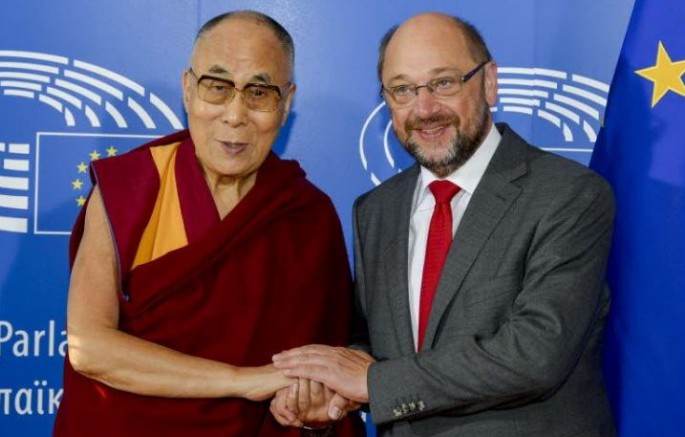 The Dalai Lama is welcomed by European Parliament president Martin Schulz at his arrival at the European Parliament.