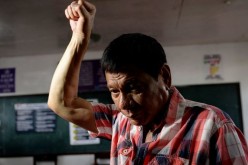 Duterte makes a fist.