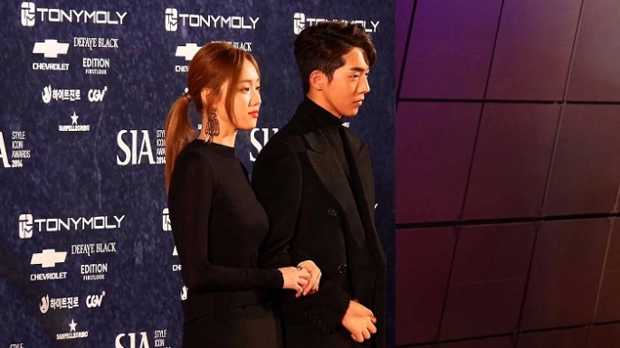 'Cheese in the Trap' stars Lee Sung-Kyung and Nam Joo-Hyuk arrive at the 2014 Style Icon Awards together.