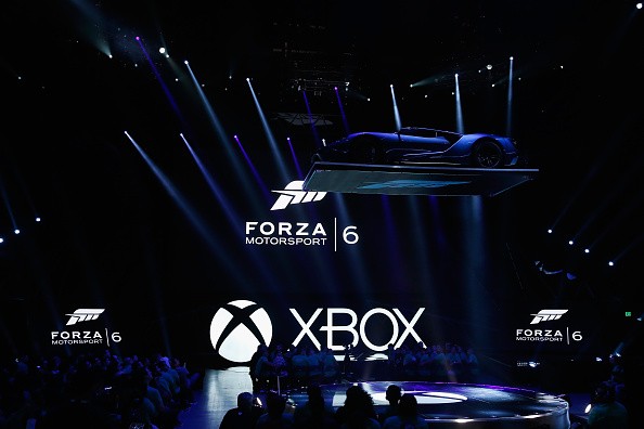 A Ford GT is lowered as 'Forza Motorsport 6' is displayed during the Microsoft Xbox E3 press conference at the Galen Center on June 15, 2015 in Los Angeles, California.