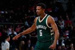 Michael Carter-Williams of the Milwaukee Bucks reacts after a basket in the second overtime of their 117-109 win over the Atlanta Hawks.