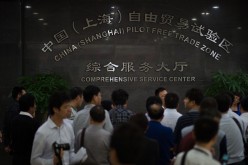 People mill around the comprehensive service center at Shanghai Free Trade Zone.
