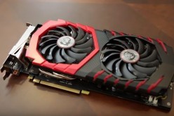 The MSI GTX 1060, not the GTX 1050 Ti, is placed on top of a table.