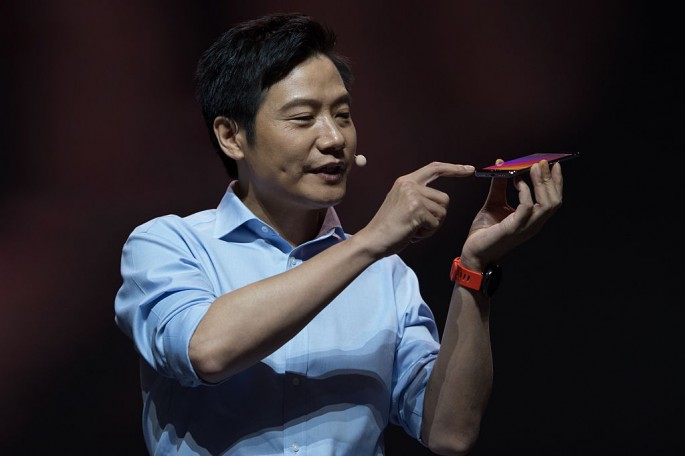 Lei Jun, Chairman and CEO of Xiaomi Technology, presents the Mi 5s and Mi 5s Plus smartphones during the launch ceremony in Beijing on Sept. 27.