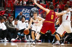 Goran Dragic drives past Kevin Love during a game between the Miami Heat and the Cleveland Cavaliers.