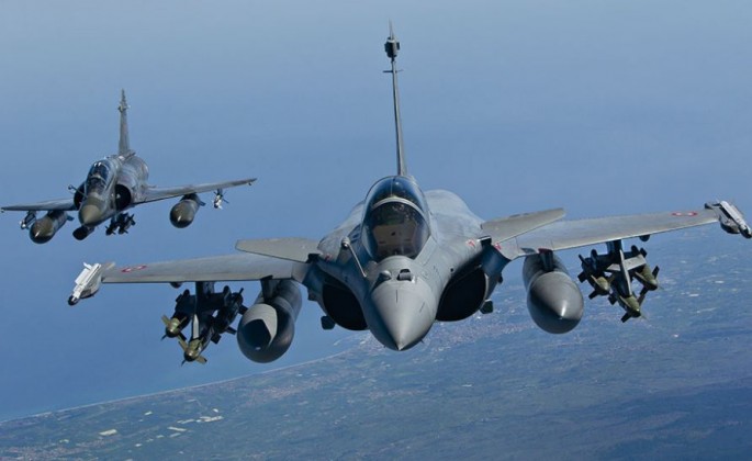 Bombed-up Rafale and a Mirage (rear).