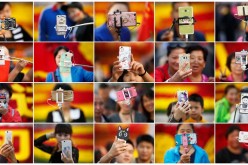 People take pictures of themselves in Tian'anmen Square as they celebrate the National Day marking the 67th anniversary of the founding of the People's Republic of China, in Beijing on Oct. 1, 2016.