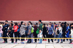 Tourists queue to enter the Palace Museum during the National Day holiday in Beijing, China, Oct. 2, 2016.