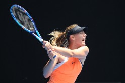 Maria Sharapova plays a backhand in her quarter final match against Serena Williams during the 2016 Australian Open.