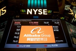An Alibaba signage shows trading activity at the New York Stock Exchange.
