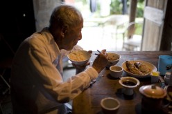 Zheng Xuechu, born in 1910, has dinner at his home in Taizhou city, East China's Zhejiang province, on June 21, 2011. 