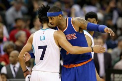 Former teammates Jeremy Lin and Carmelo Anthony shake hands after the Hornets defeated the Knicks on November 11, 2015.