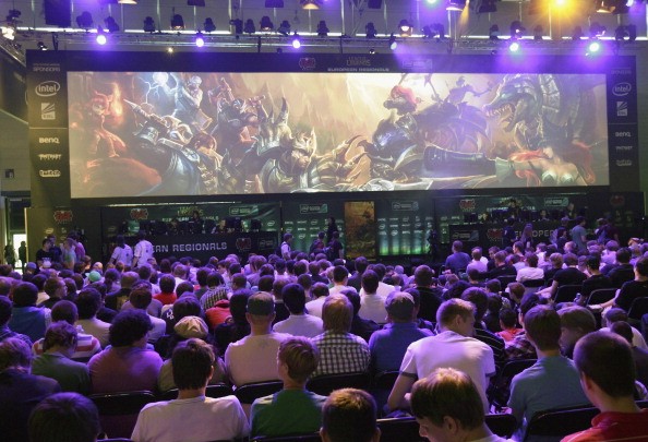 Gaming enthusiasts watch a League of Legends game 3 at the Gamescom 2012 gaming trade fair on August 16, 2012 in Cologne, Germany.