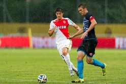 Monaco striker Guido Carrillo (L).