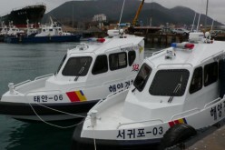 Two of the smaller Korea Coast Guard patrol boats at anchor.