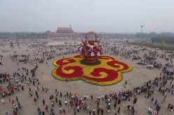 Center of attraction: This photo taken on Sept. 25, 2016, shows a huge “flower basket” decoration resting on Tiananmen Square, aiming to charm tourists celebrating the National Day on Oct. 1.