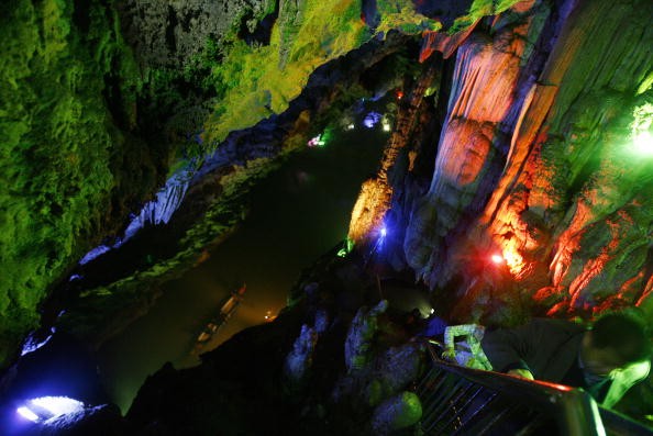 Tourists on a boat take sightseeing in the Longlin Palace Karst Cave on April 25, 2007 in Enshi Tujia and Miao Autonomous Prefecture of Hunan Province, China.
