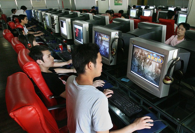 Chinese gamers play online computer games at an Internet cafe in Shanghai.