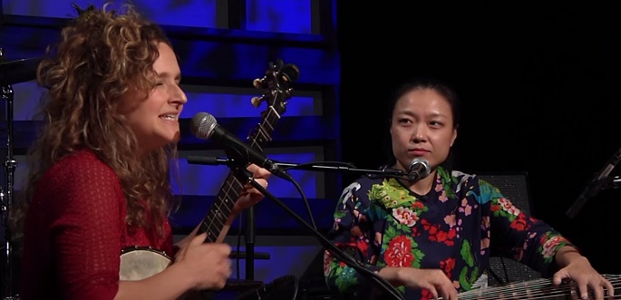 Abigail Washburn closes her eyes as she feels the music as Wu Fei looks at her during their performance at the radio show, “Music City Roots, Live from the Factory” on Dec. 9, 2015.