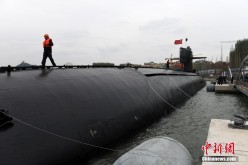 The nuclear submarine berths at the wharf of the Navy Museum in Qingdao, east China's Shandong Province, Sunday, Oct. 16, 2016.