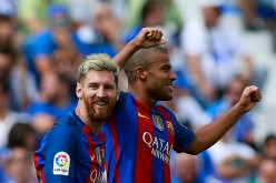 Barcelona players Lionel Messi (L) and Rafinha.