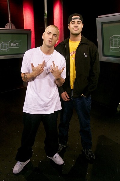 Eminem poses for a photo with Carson Daly on set of TRL at the MTV Studios in New York City on May 10, 2000. 
